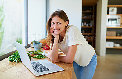Buy stock photo Cooking, home and woman with food, laptop and vegetable lunch for online search. Diet, wellness and girl at kitchen counter with website for recipe research, ingredients and nutrition for gut health