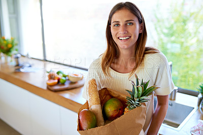 Buy stock photo Groceries, bag and portrait of woman in kitchen with healthy food, cooking or meal prep with smile. Diet, wellness and person in home with shopping, delivery and ingredients for dinner in apartment.