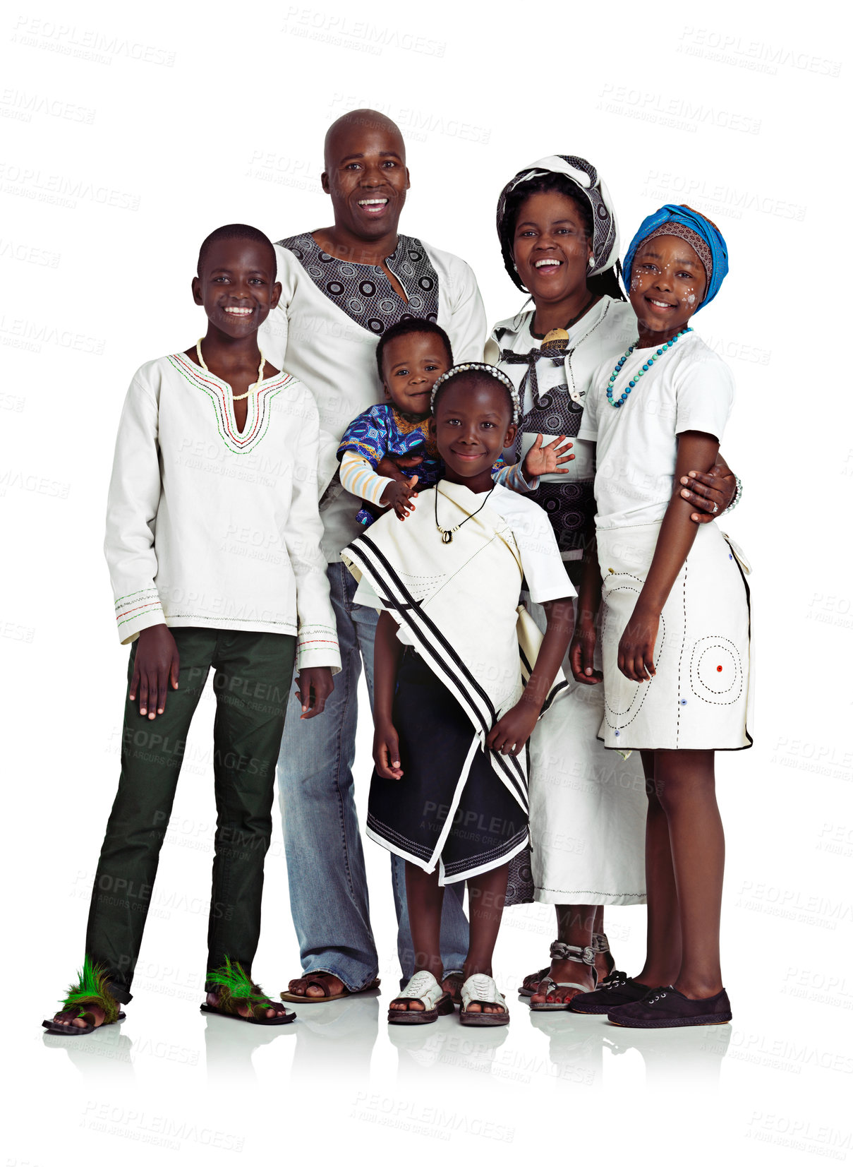 Buy stock photo Studio shot of a traditional african family smiling happily, isolated on white