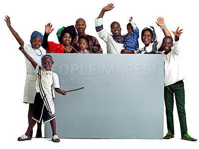 Buy stock photo Studio shot of a large african family holding a blank board, isolated on white