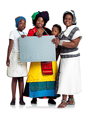 Buy stock photo Studio shot of two african women with their kids holding a blank board, isolated on white