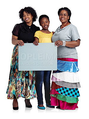 Buy stock photo Studio shot of two african women with a teenage girl holding a blank board