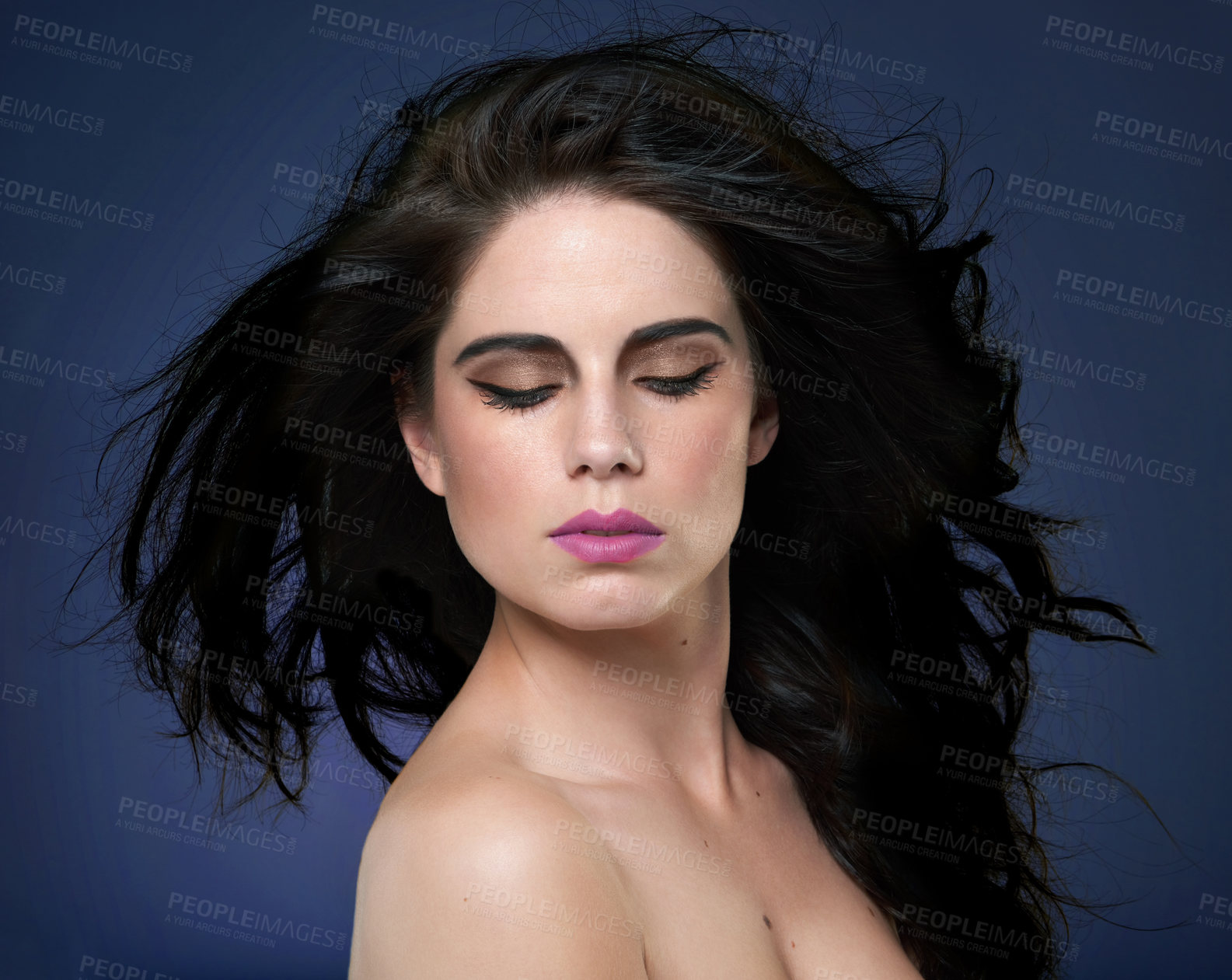 Buy stock photo Calm, beauty and woman in studio for hair cosmetics, shine and luxury wellness on blue background. Makeup, glamour and model with shampoo, scalp or glow haircare results, growth and smooth texture