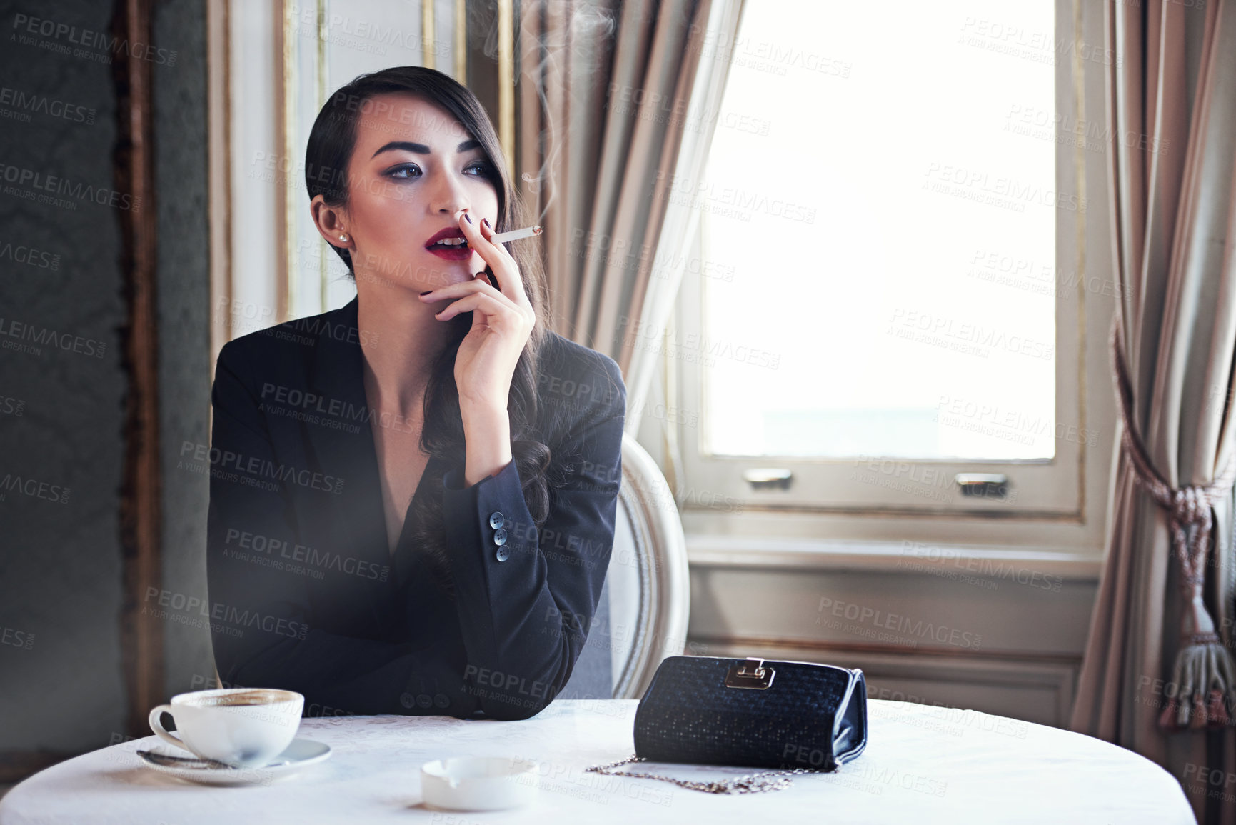 Buy stock photo Woman, cigarette and smoke in cafe with vintage style, relax and drink with tea cup, confident and fashion. Girl, person and thinking with tobacco in elegant suit at coffee shop on vacation in Rome