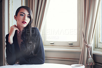 Buy stock photo Shot of an elegant woman  in a luxurious setting daydreaming