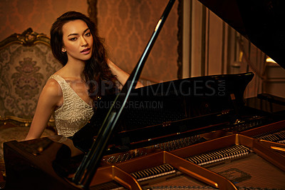 Buy stock photo Mansion, woman and piano with musician, lounge and pianist in a ballroom with luxury instrument. Entertainment, palace and vintage fashion of sound artist with song and playing with glamour and style