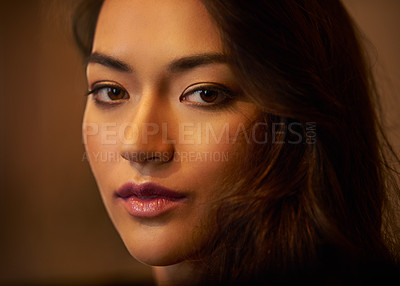 Buy stock photo Closeup portrait of a gorgeous young woman's face in beautiful lighting