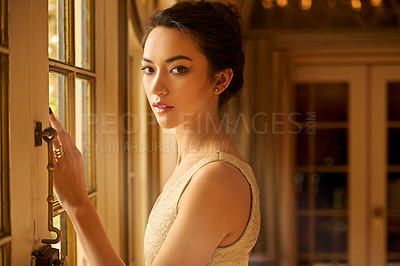 Buy stock photo Portrait of a beautiful young woman dressed elegantly in her home