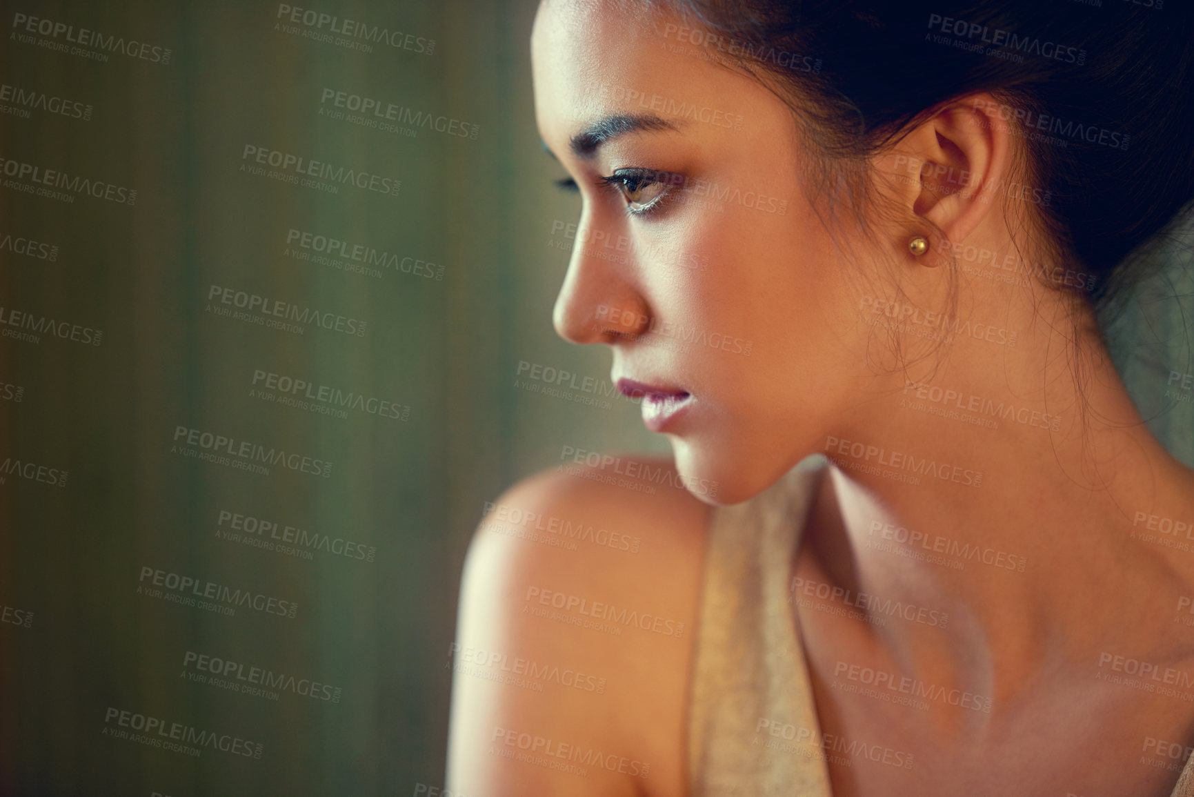Buy stock photo Profile shot of a beautiful young woman dressed elegantly indoors