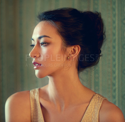 Buy stock photo Profile shot of a beautiful young woman posing against a patterned green background