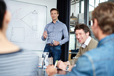 Buy stock photo Shot of a group of colleagues in a presentation