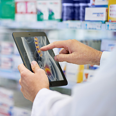 Buy stock photo A pharmacist working on a digital tablet