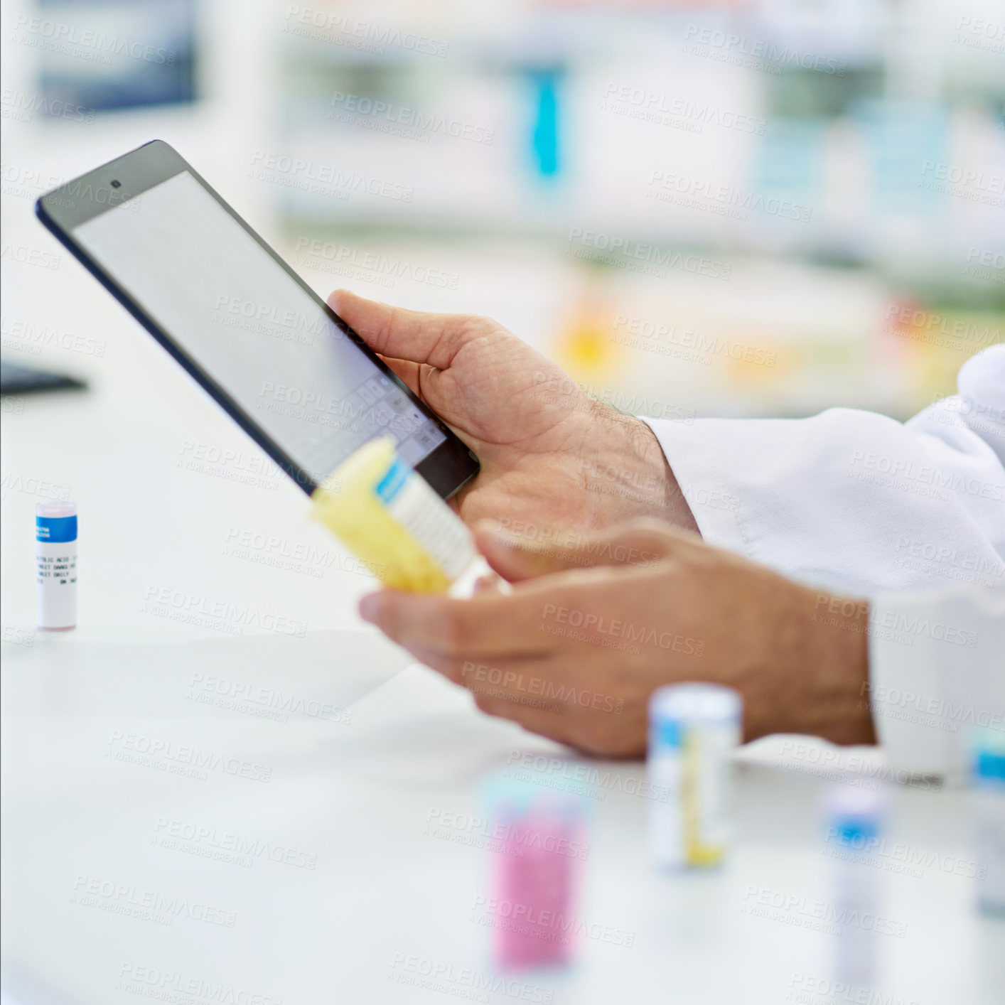 Buy stock photo A pharmacist working on a digital tablet