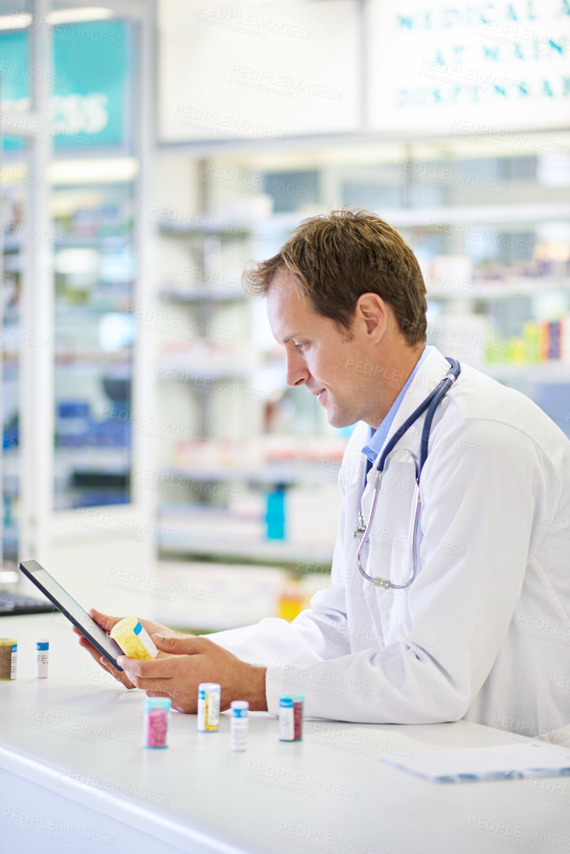 Buy stock photo Doctor, tablet and chemist for pills, dispensary and medicine in drugstore for inventory or telehealth. Male person, pharmacist and pharma in clinic for prescription, stock for information or advice