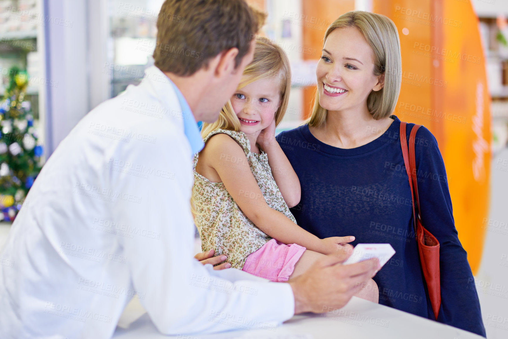 Buy stock photo Pharmacist, mother and girl with medicine in store for healthcare, wellness and advice for people. Pills, mom and daughter with box, supplements or retail discount for pharmaceutical product at shop