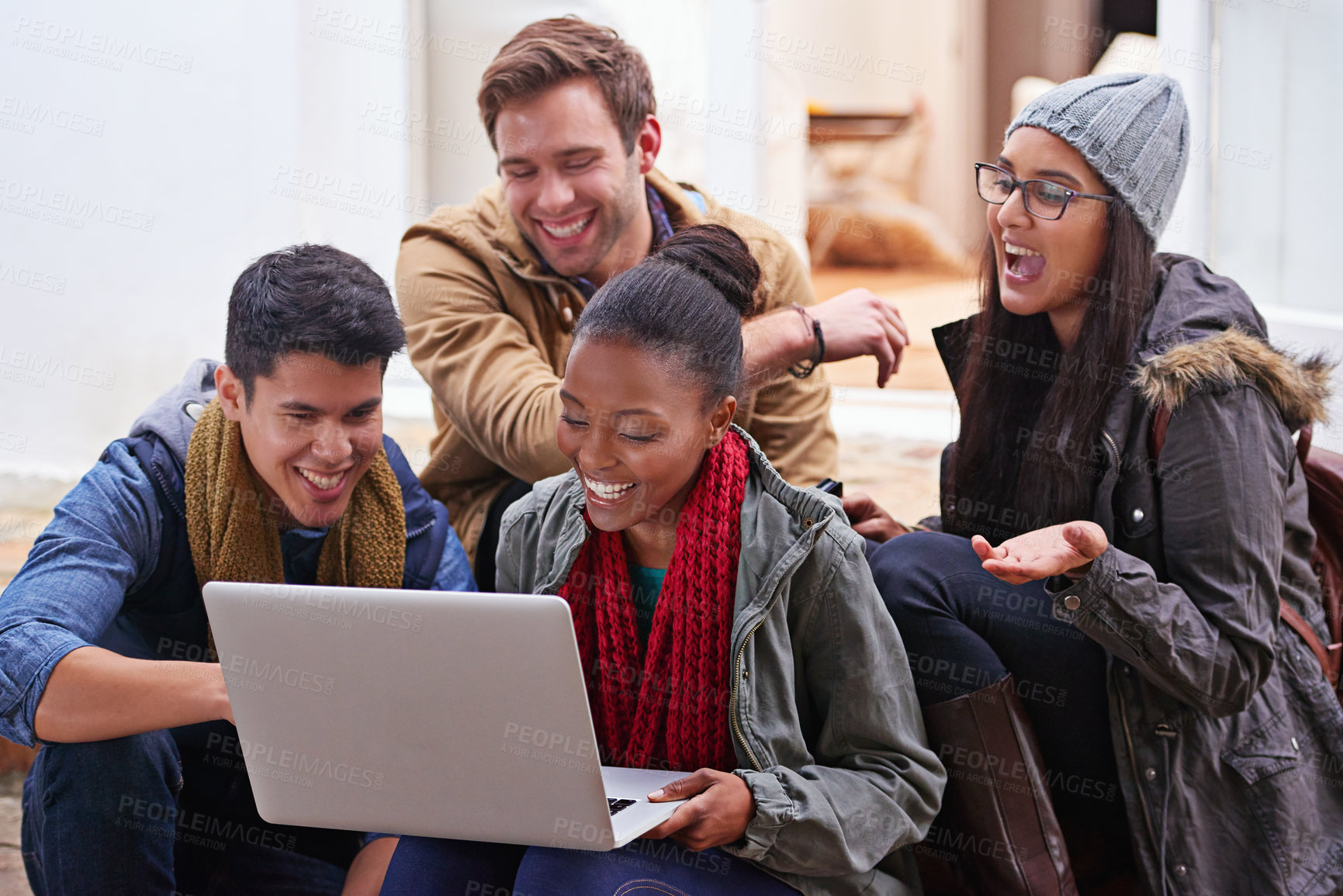 Buy stock photo Cropped shot of a university students using a laptop while sitting on campus