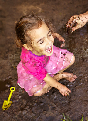Buy stock photo Girl, child and fun with laugh in mud for freedom, playing and muddy in sunshine weather or outdoor. Kid, female person and face with happiness for activity, enjoyment and relax with toy in cirt