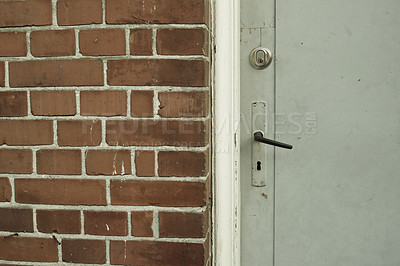 Buy stock photo Brick wall, door and building in urban area for design, texture and architecture for construction. Concrete, pattern and vintage structure for development, exterior and maintenance in old town.