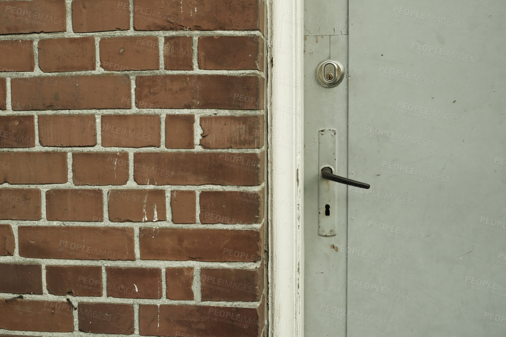 Buy stock photo Brick wall, door and building in urban area for design, texture and architecture for construction. Concrete, pattern and vintage structure for development, exterior and maintenance in old town.