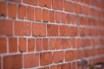 Buy stock photo Brick wall, closeup or focus with blur or strong for house, construction with concrete and mortar. Texture, background or zoom with center and haze for building, pattern or architecture or stone