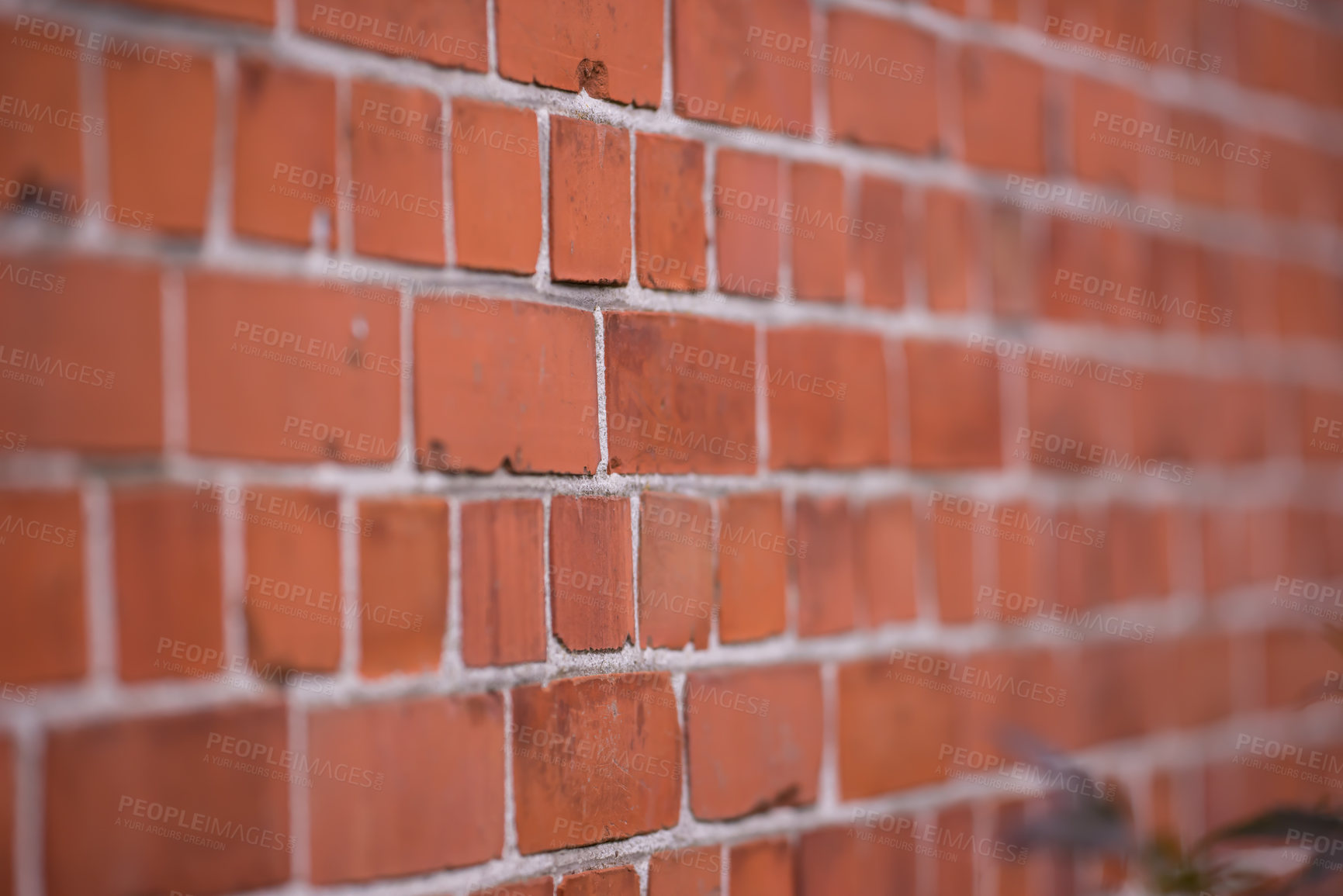 Buy stock photo Brick wall, closeup or focus with blur or strong for house, construction with concrete and mortar. Texture, background or zoom with center and haze for building, pattern or architecture or stone