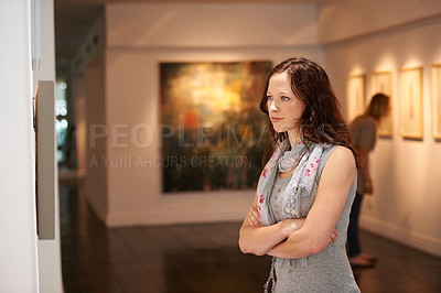 Buy stock photo Woman, gallery and thinking at art exhibition, museum or study creative paintings on show in artist studio. Painting on wall, focus and girl studying abstract artwork, culture or buyer in Venice