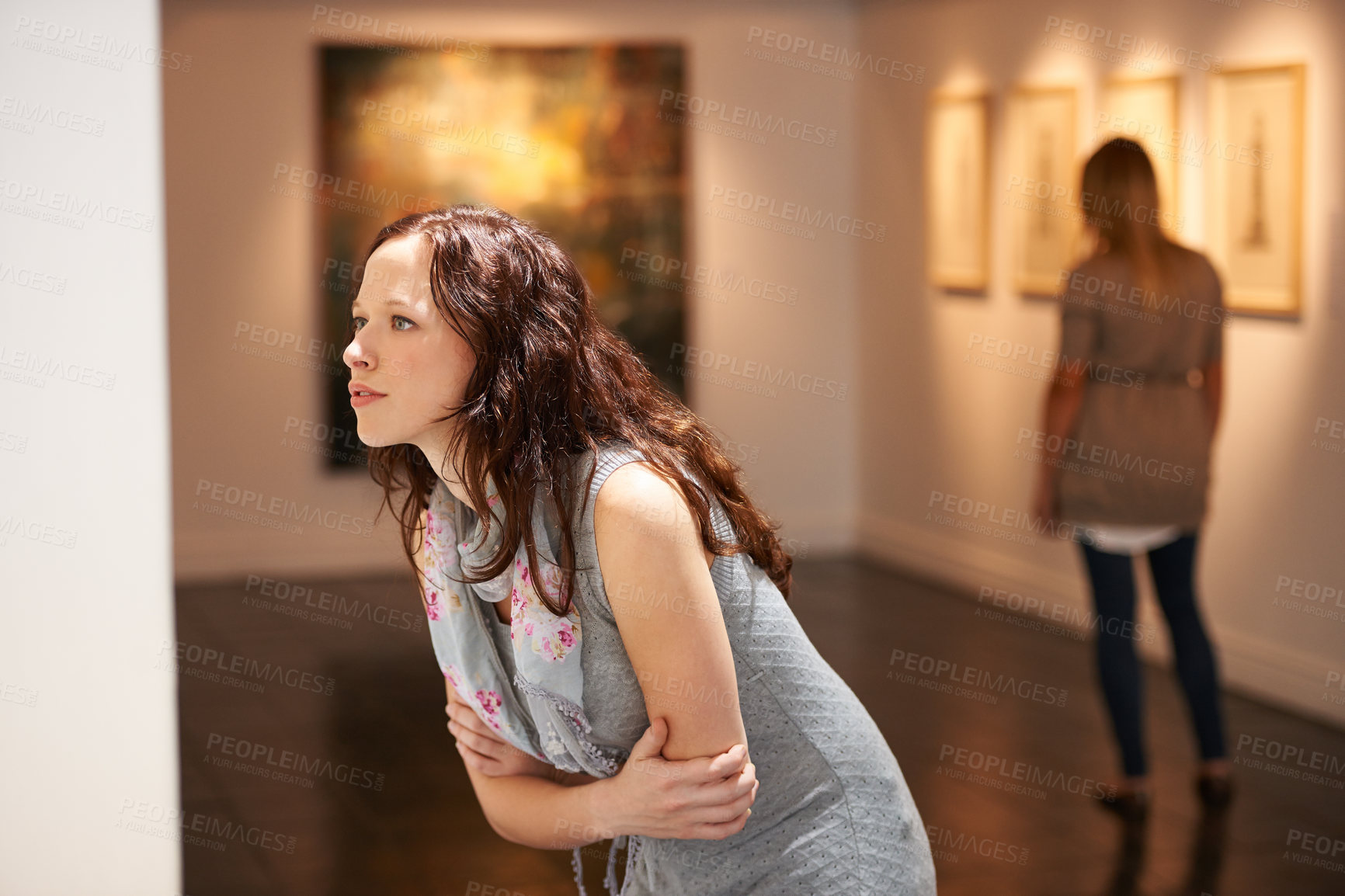Buy stock photo Gallery, woman and studying art at exhibition, museum or creative painting on a wall for a show in artist studio. Study, thinking and girl with focus on abstract paintings, culture or artwork buyer
