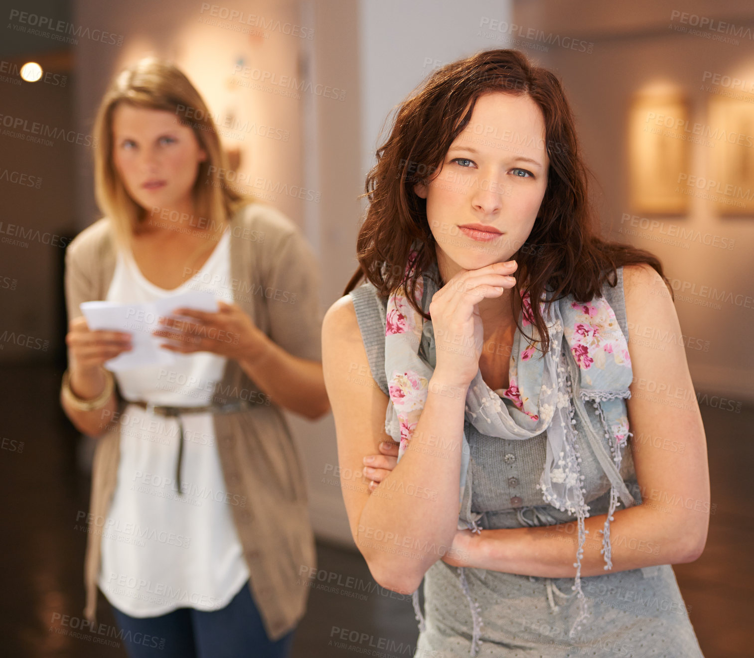 Buy stock photo Looking, portrait and women at a gallery for art, creativity and paintings on display on the weekend. Thinking, young and friends or people at a museum for education and learning about culture