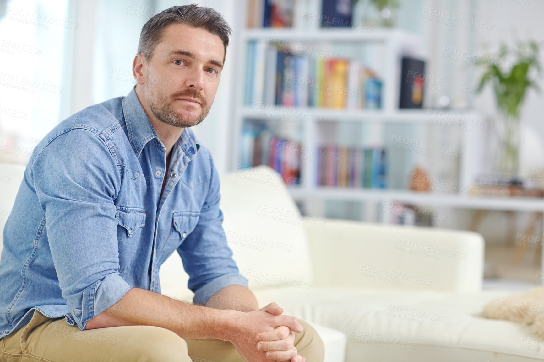 Buy stock photo Portrait, mature and man on sofa in home to relax for comfort or break in living room. Property, confident person and serious male interior designer on weekend in house, apartment or lounge on couch