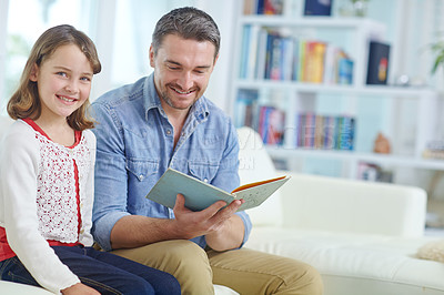 Buy stock photo Education, learning or reading with father and daughter on sofa in living room together for bonding or study. Book, literature or storytelling with girl and dad in apartment for child development