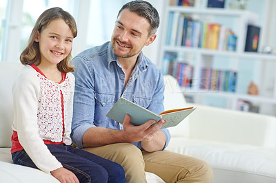 Buy stock photo Book, education or learning with father and daughter on sofa in living room together for bonding or study. Literature, reading or storytelling with girl and dad in apartment for child development