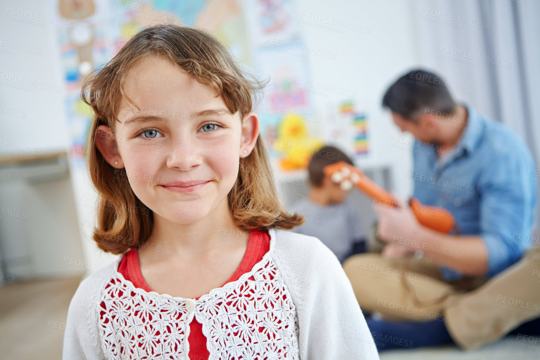 Buy stock photo Portrait of an adorable little girl spending the day with her father and brother at home