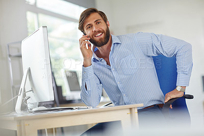 Buy stock photo Shot of a handsome male designer talking on his phone