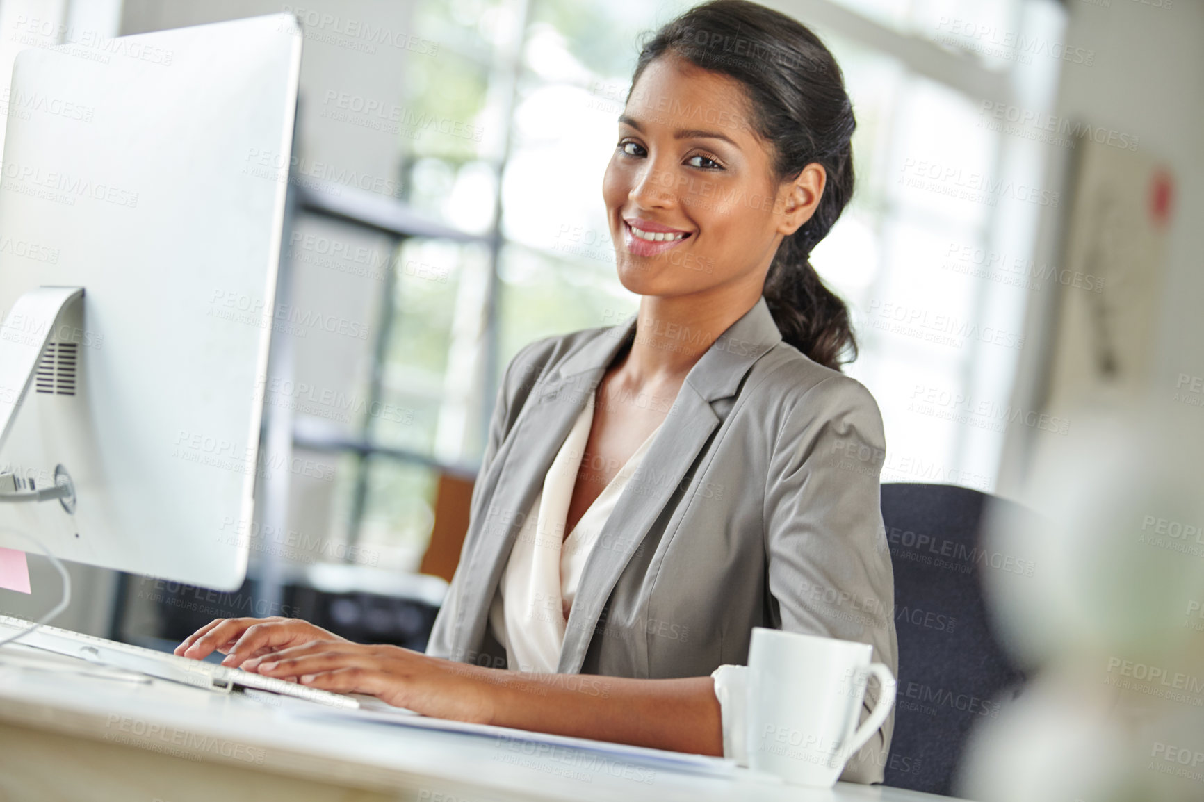 Buy stock photo Portrait of a beautiful businesswoman sitting at her desk