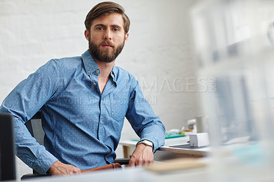 Buy stock photo Portrait of a serious designer sitting in his office