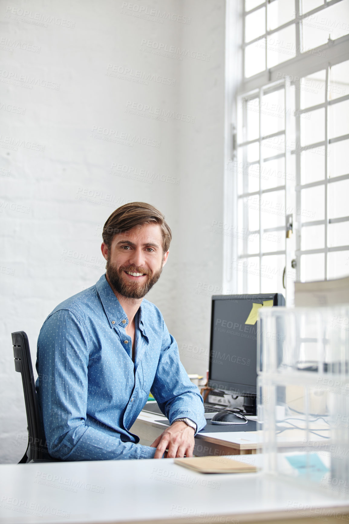 Buy stock photo Shot of a handsome designer smiling at the camera