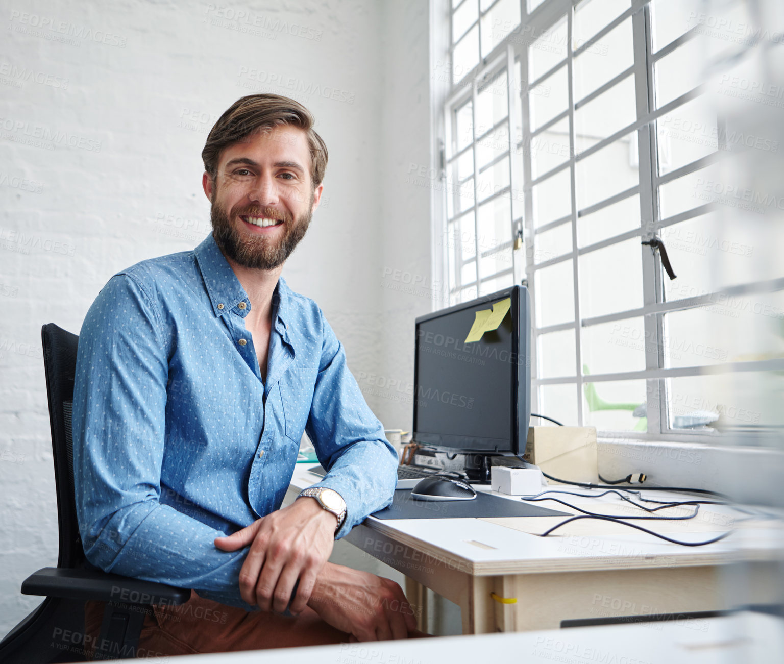 Buy stock photo Shot of a handsome designer smiling at the camera