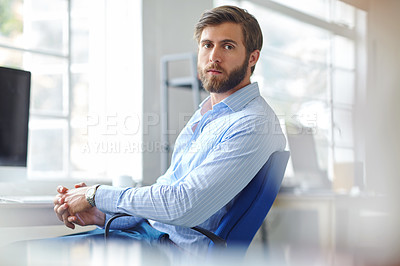 Buy stock photo Portrait of a handsome designer sitting on an office chair