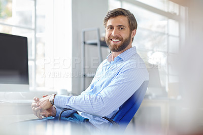 Buy stock photo Portrait of a handsome designer sitting on an office chair