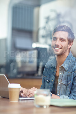 Buy stock photo Shot of a handsome young man sitting with his laptop in a coffee shop