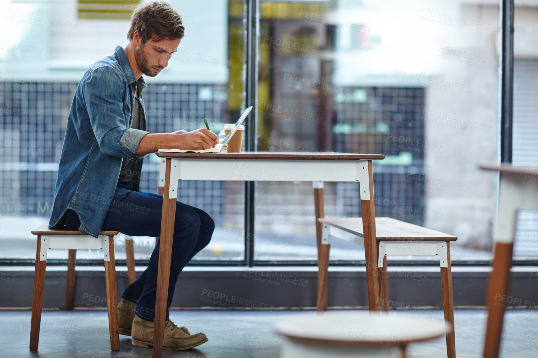 Buy stock photo Cafe, laptop and man with notebook for writing, research information and schedule for freelance story. Coffee shop, male person and writer with journal for remote work, blog review and to do list