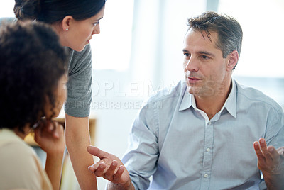 Buy stock photo Shot of a group of coworkers having a discussion in the office