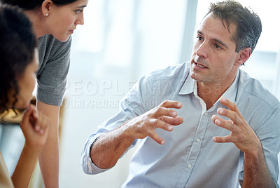 Buy stock photo Shot of a group of coworkers having a discussion in the office