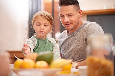Buy stock photo Family, father and kid eating breakfast in home together for healthy diet, nutrition or wellness in the morning for development. Food, parent and happy dad with girl at table with fruits for growth