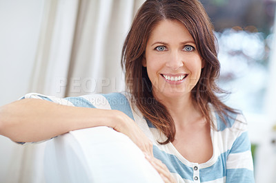 Buy stock photo Portrait of a beautiful woman relaxing on the sofa at home