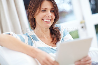 Buy stock photo Happy, woman and relax with tablet on couch for home budgeting, online banking and financial management. Girl, smile and internet in house for credit score, report review or monitor digital finances.