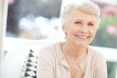 Buy stock photo Portrait of a happy elderly woman enjoying a relaxing day at home