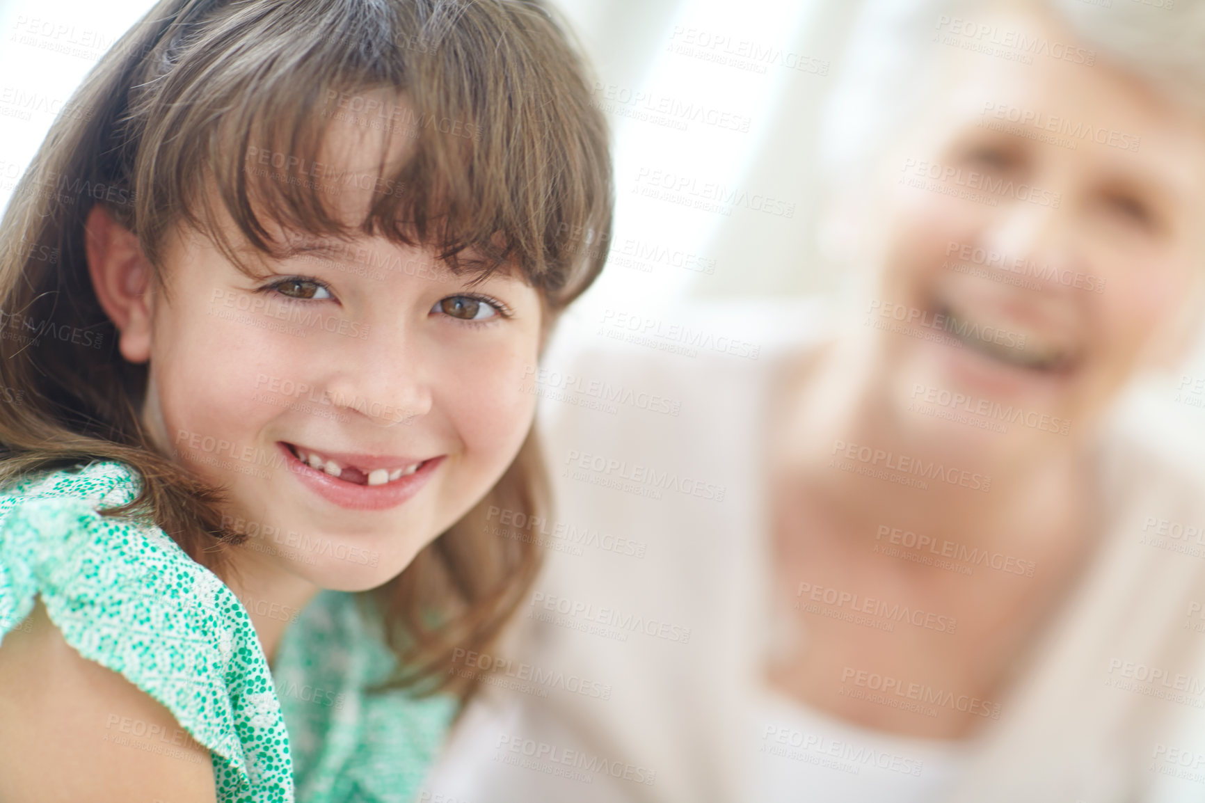 Buy stock photo Portrait of a loving grandmother and granddaughter spending time together at home