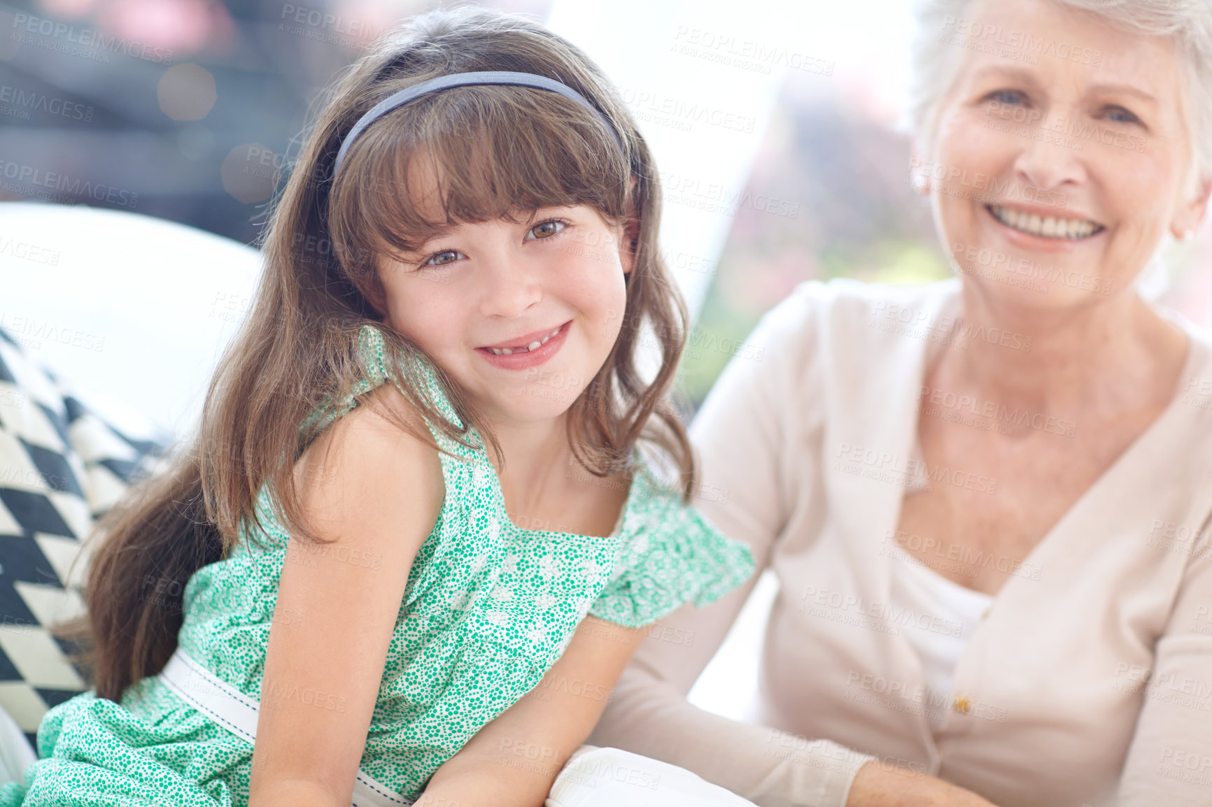 Buy stock photo Portrait of a loving grandmother and granddaughter spending time together at home