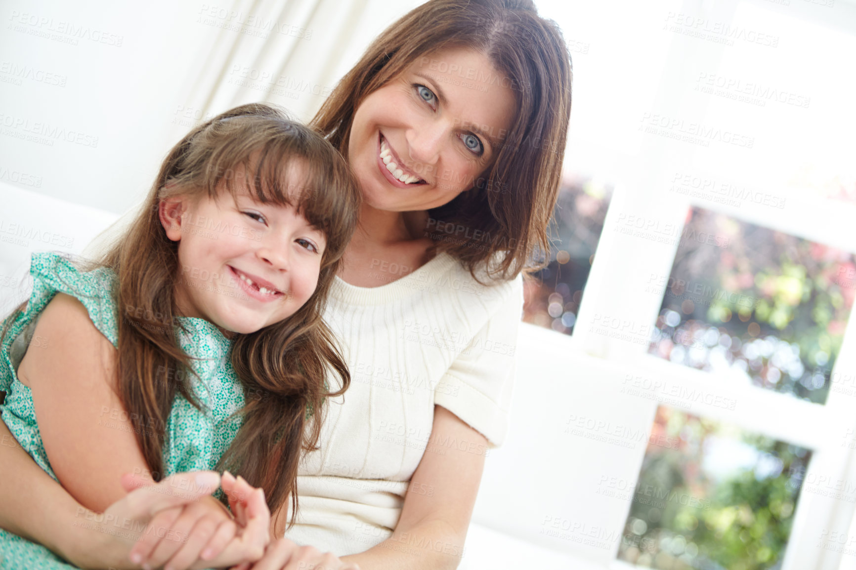 Buy stock photo Portrait of a cute little girl spending time with her mother at home